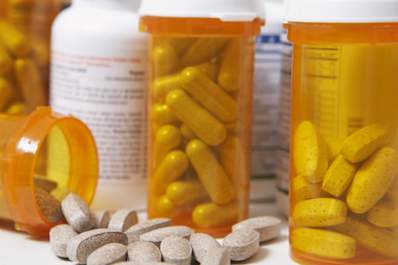Supplements spilling out of pill bottles