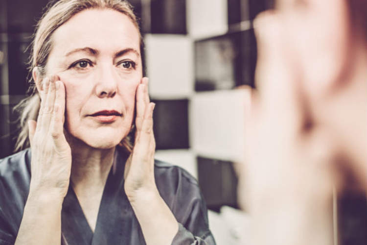 woman applying skin cream