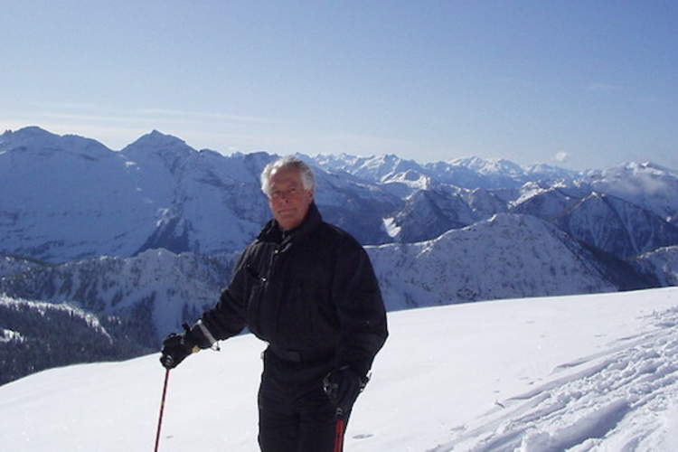 Fred skiing in mountains.