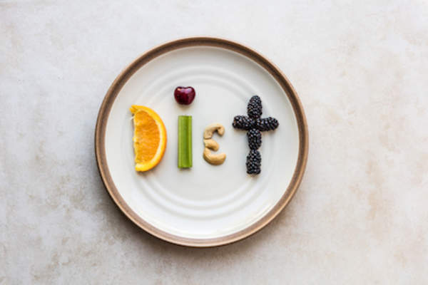 Diet written on plate with low carb food