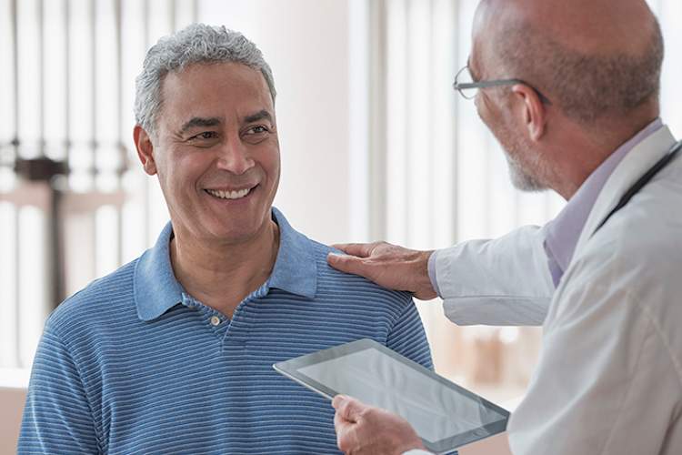 Doctor describing lymphoma treatments to a patient.