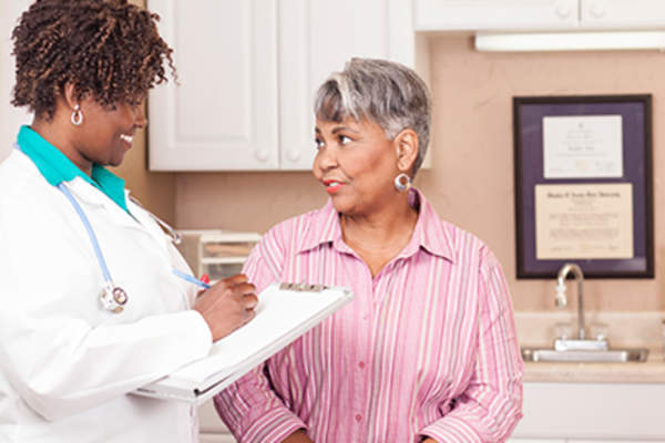 Senior woman talking to her female doctor.