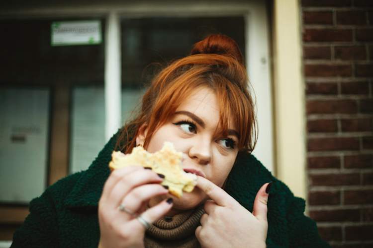woman eating sandwich