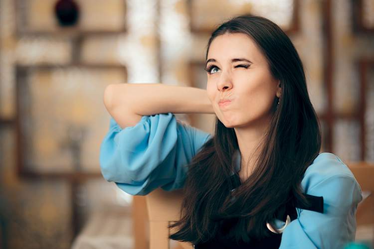 Young woman trying to remember something.