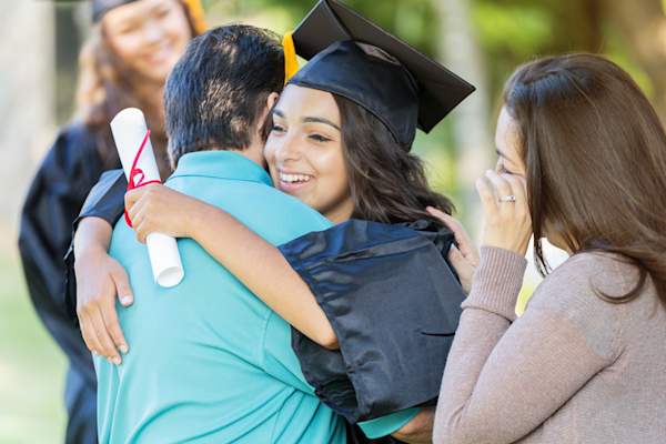 Parents celebrating daughter graduating.