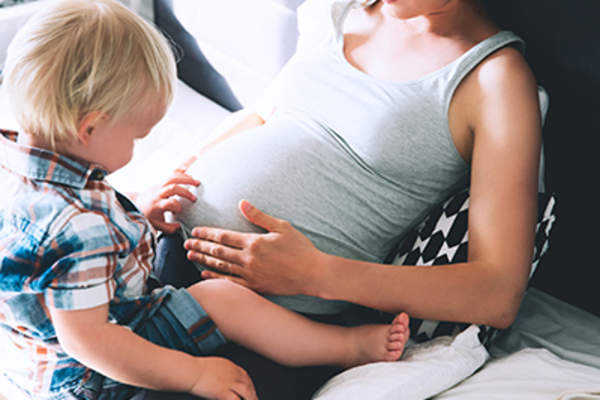 Pregnant mother and toddler son.