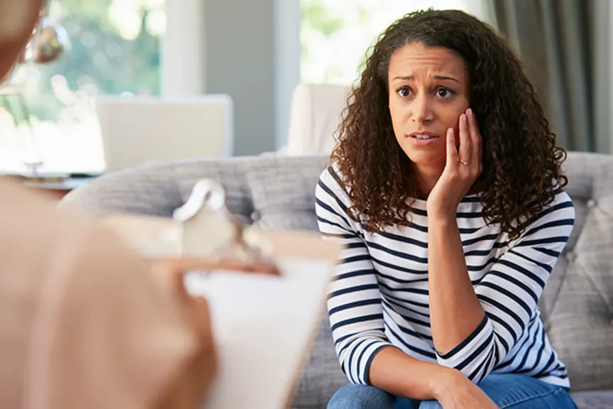 Woman talking to a therapist.