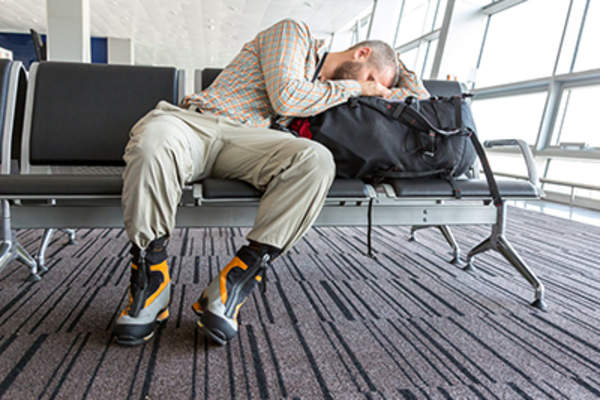 Man sleeping at an airport