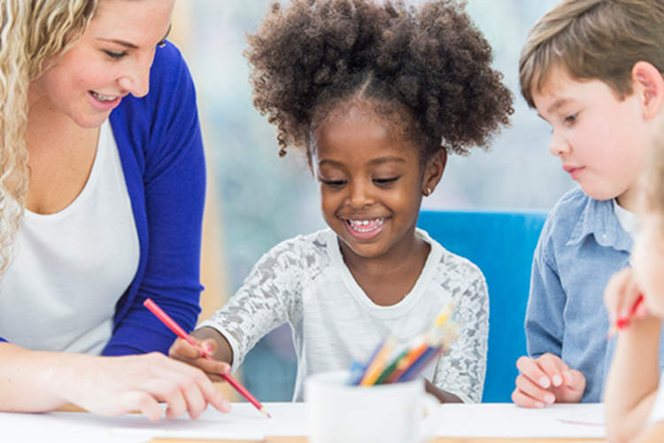 Children working with teacher.
