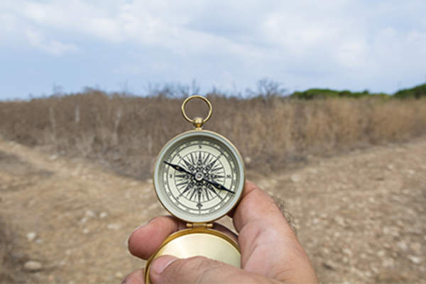Man holding compass.