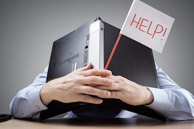 Man with laptop over head needs help for depression.