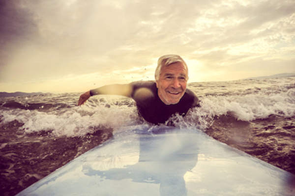 Older man surfing