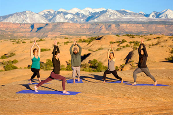 Sunset yoga class outside in Utah.