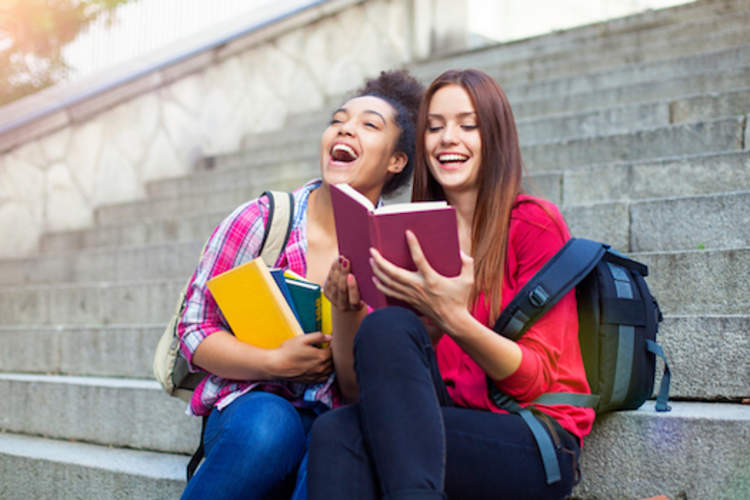 Teenaged friends sharing a laugh after school.