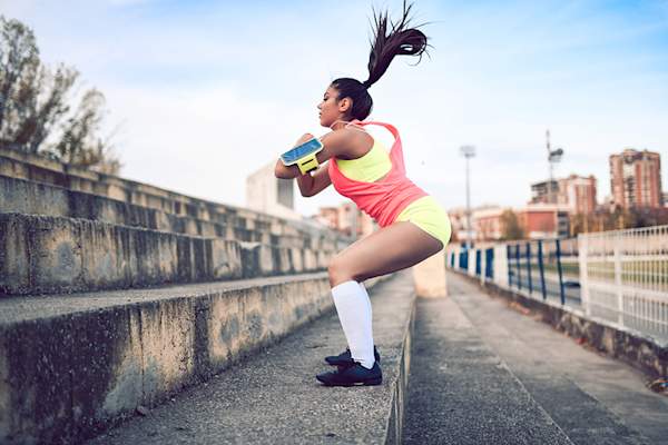 Woman jumping on stairs