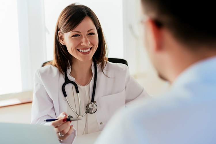 Doctor smiling at her patient.