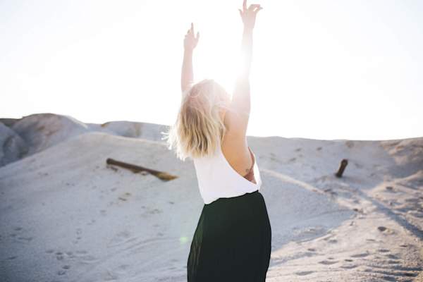 woman with arms in the air