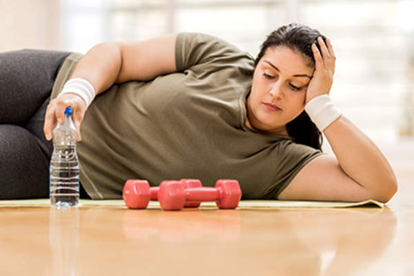 Woman too tired to exercise.