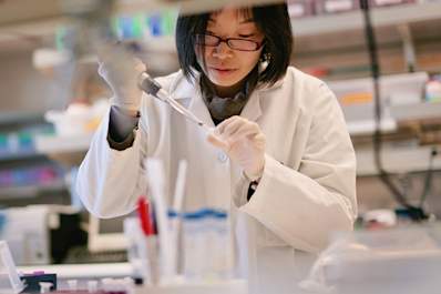 Female scientist performing medical research.