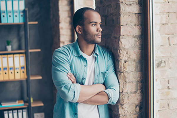 Man feeling envious of people without psoriatic arthritis.