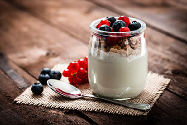 Yogurt with berries and granola.