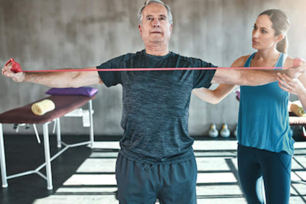 Man working out with a trainer.