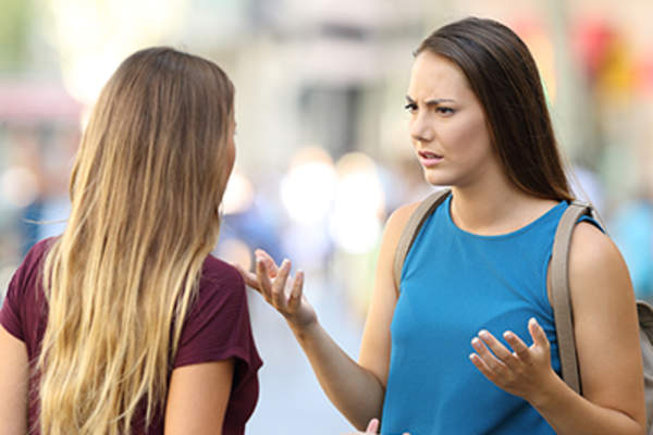 Friends arguing in public.