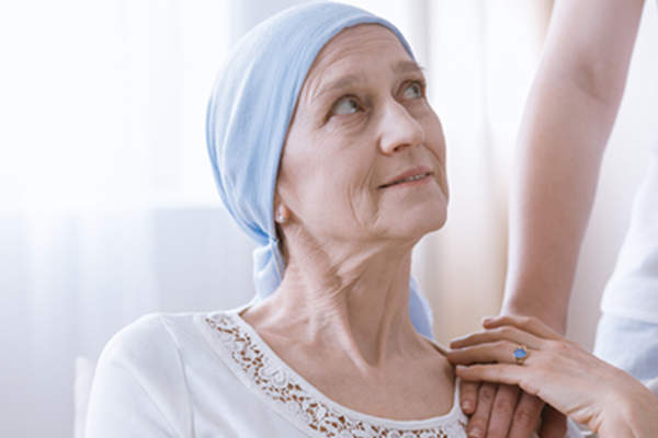 Woman with support and hope after cancer treatment.