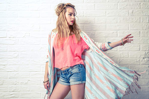 Woman wearing pastel clothes.