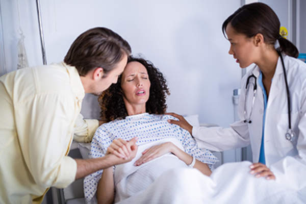 Woman giving birth.