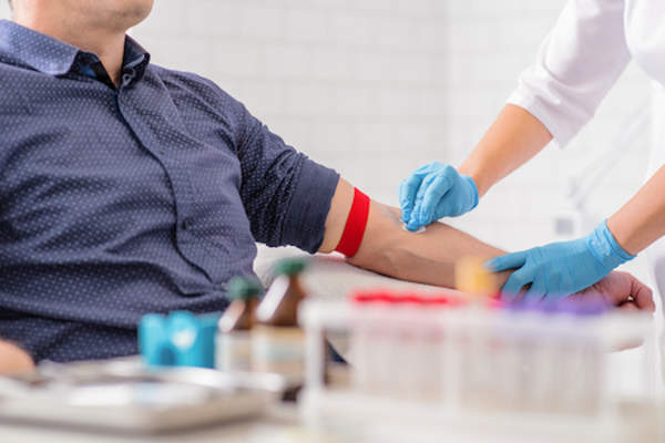 Man having blood test.