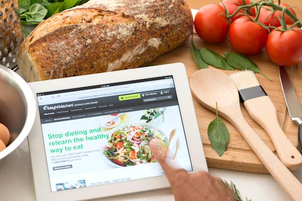 Weightwatchers.com website on a digital tablet in a kitchen
