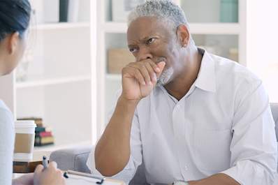 Senior man talking to doctor about depression.