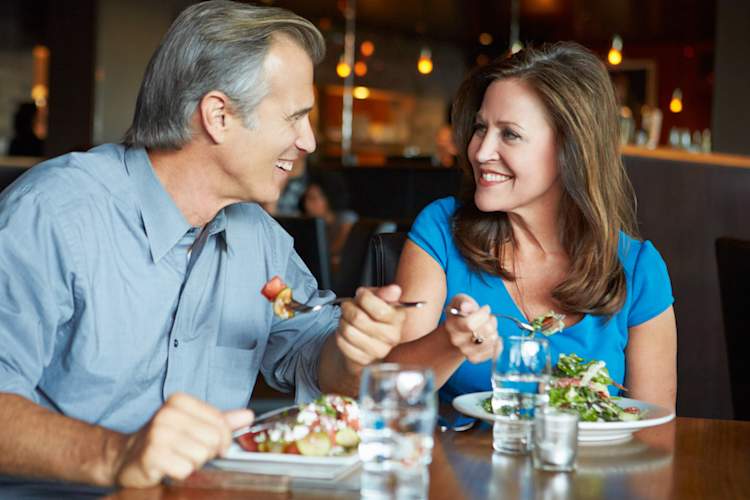 Middle aged people on date.