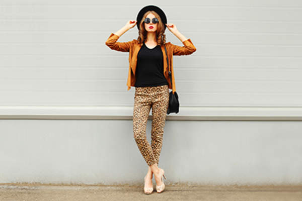 Woman wearing leopard print pants.
