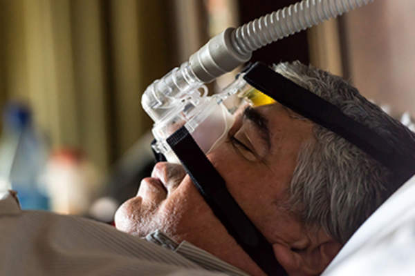 Man with sleep apnea sleeping.