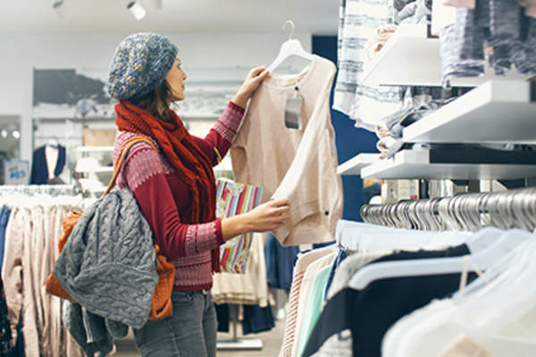 Woman shopping for psoriasis-friendly clothing.