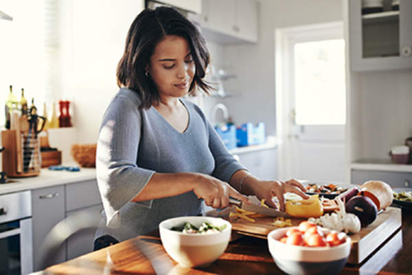 Woman cooking a healthy meal.