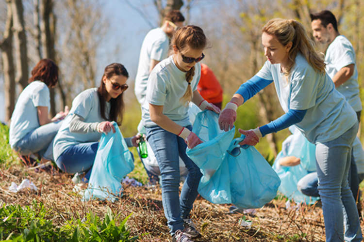 Young people volunteering clean up image.
