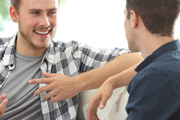 Men having a conversation image.