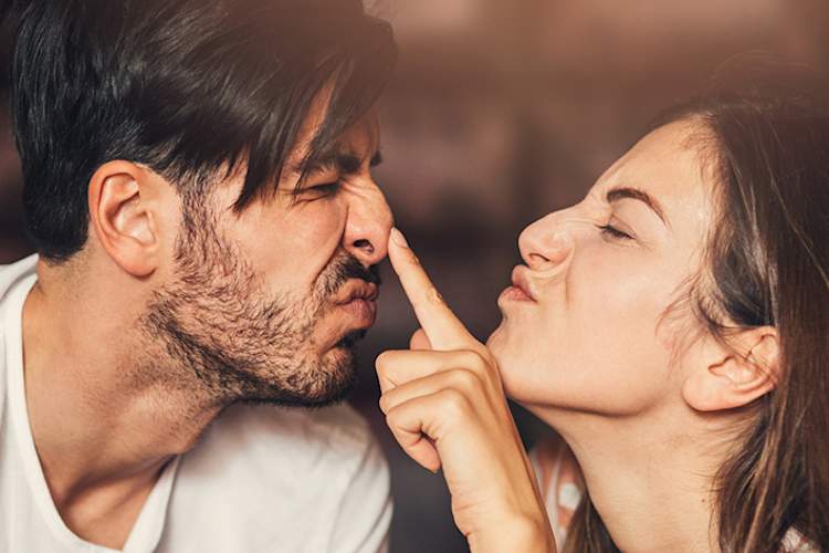Playful young couple noses
