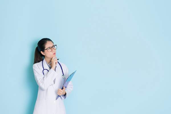 Young thoughtful doctor.