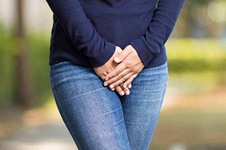 Woman with Hands Holding her Crotch