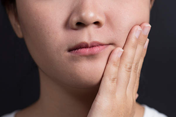 Woman with facial swelling.