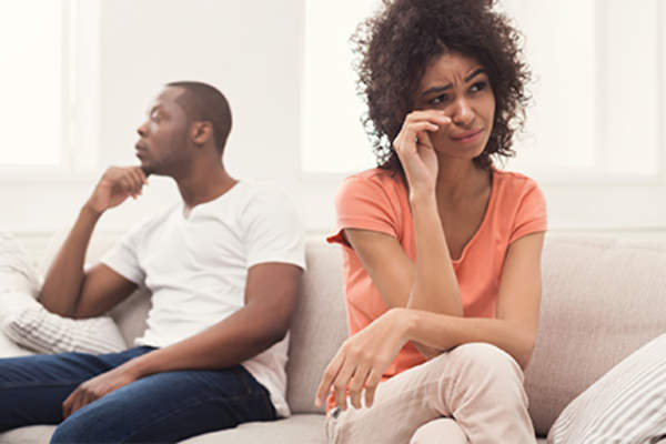 Resentful couple at home.