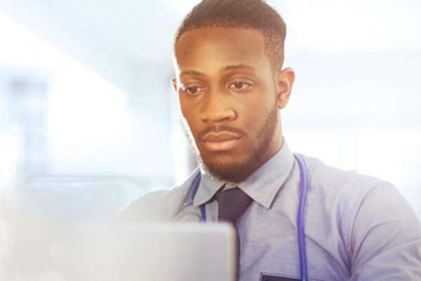 Medical doctor looking over research data.