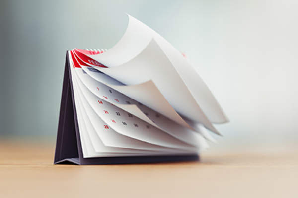 Pages on a calendar flipping.