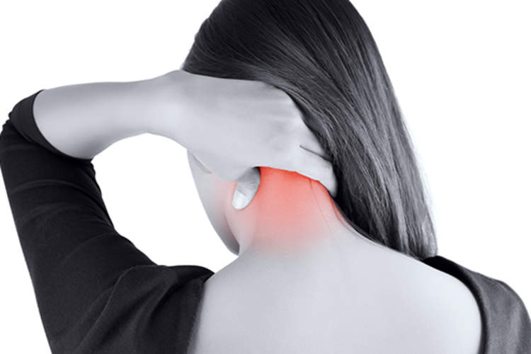 Young woman with back of neck pain.