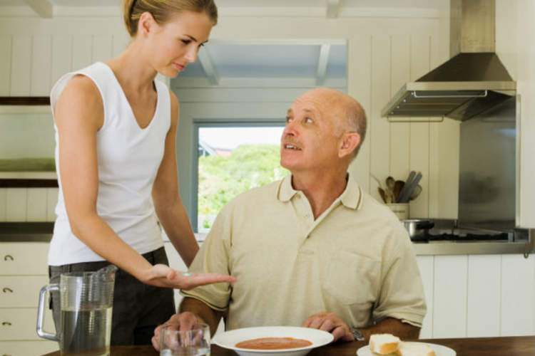 Man get pill from daughter with dinner
