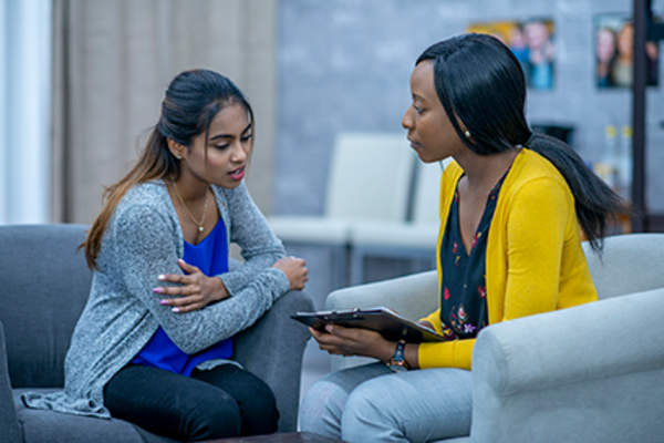 Woman talking to a mental health counselor.